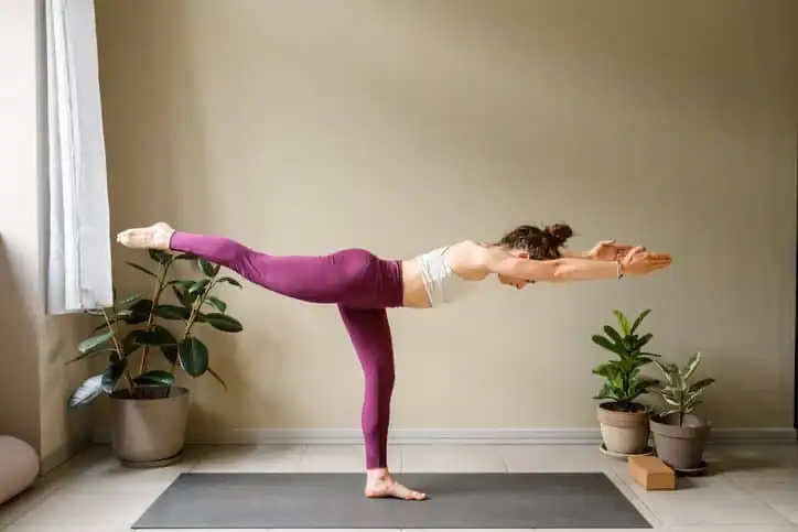 Woman doing Yoga exercise Bedford to help with toning the body. 