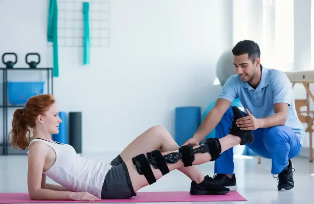 Woman having treatment to help muscle recovery Bedford after an injury